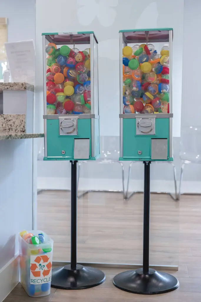 Gumball machines filled with colorful toys in a Miami orthodontic office, emphasizing a welcoming atmosphere for families and children seeking braces and Invisalign treatments.